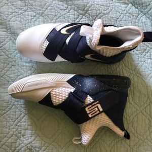 White and Blue Nike Lebron Basketball shoes